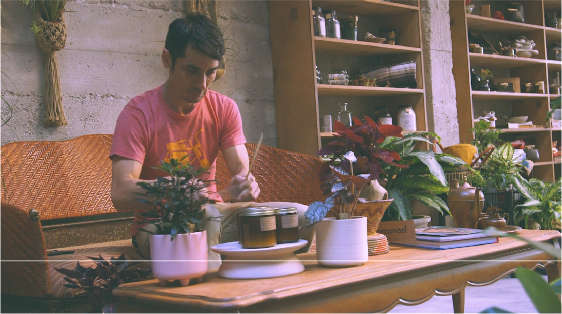 A person holds drumsticks to "play" various objects.